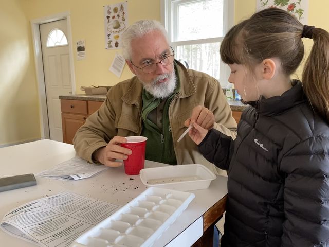 Mike Roche with his granddaughter Clara Lovell, 7, at an April workshop at the School of Conservation in Sussex County.